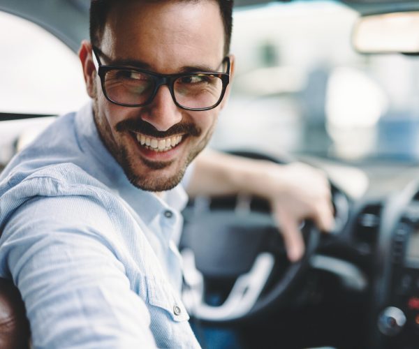 portrait-of-a-businessman-driving-car.jpg